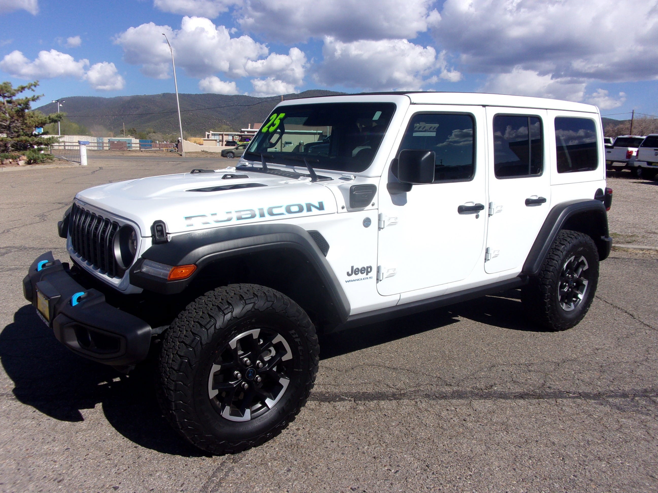 2025 Jeep Wrangler 4xe Rubicon in White — front three-quarter view