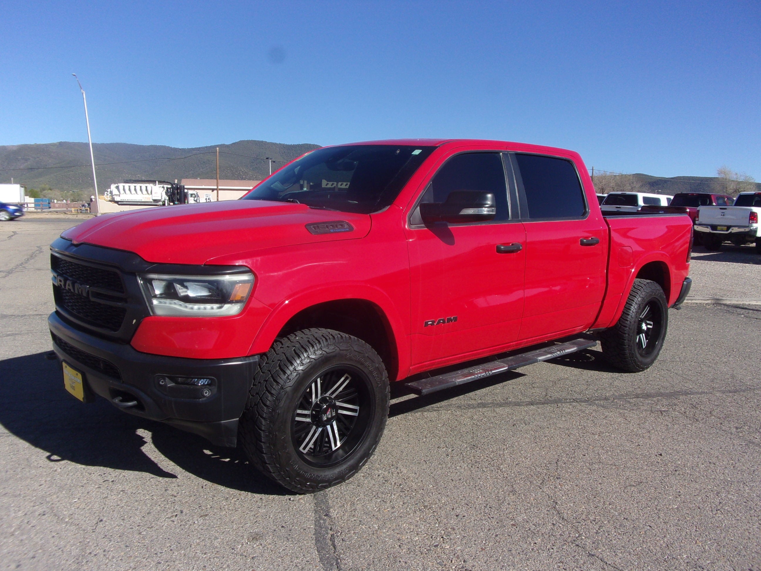 2021 RAM 1500 Big Horn in Red — front three-quarter view
