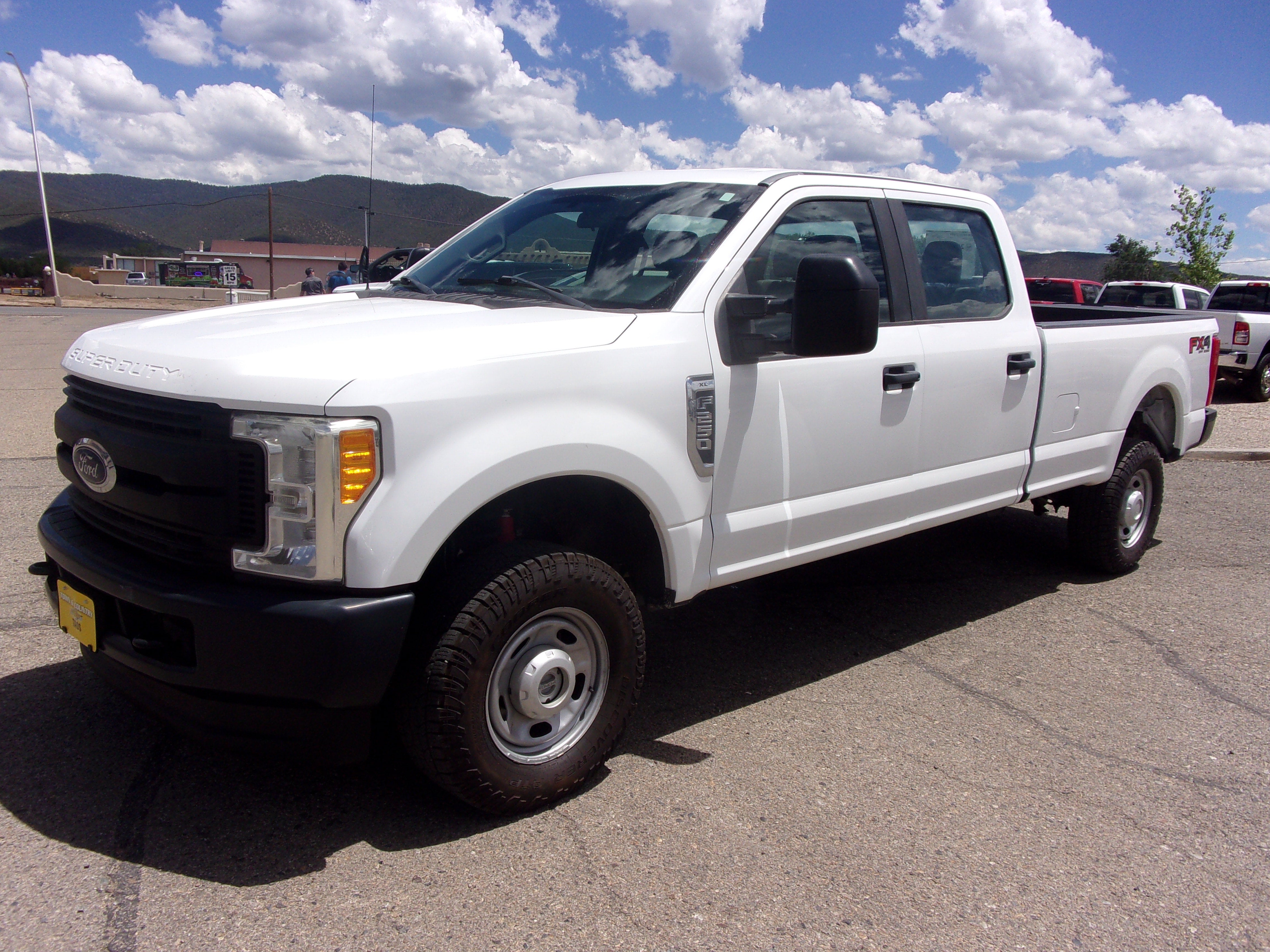 2017 Ford Super Duty F-250 SRW Lariat in White — front three-quarter view